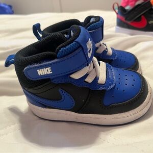 Blue children’s Nikes worn once